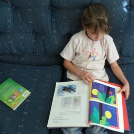 My Youngest Sister reading the Big Blue Book.